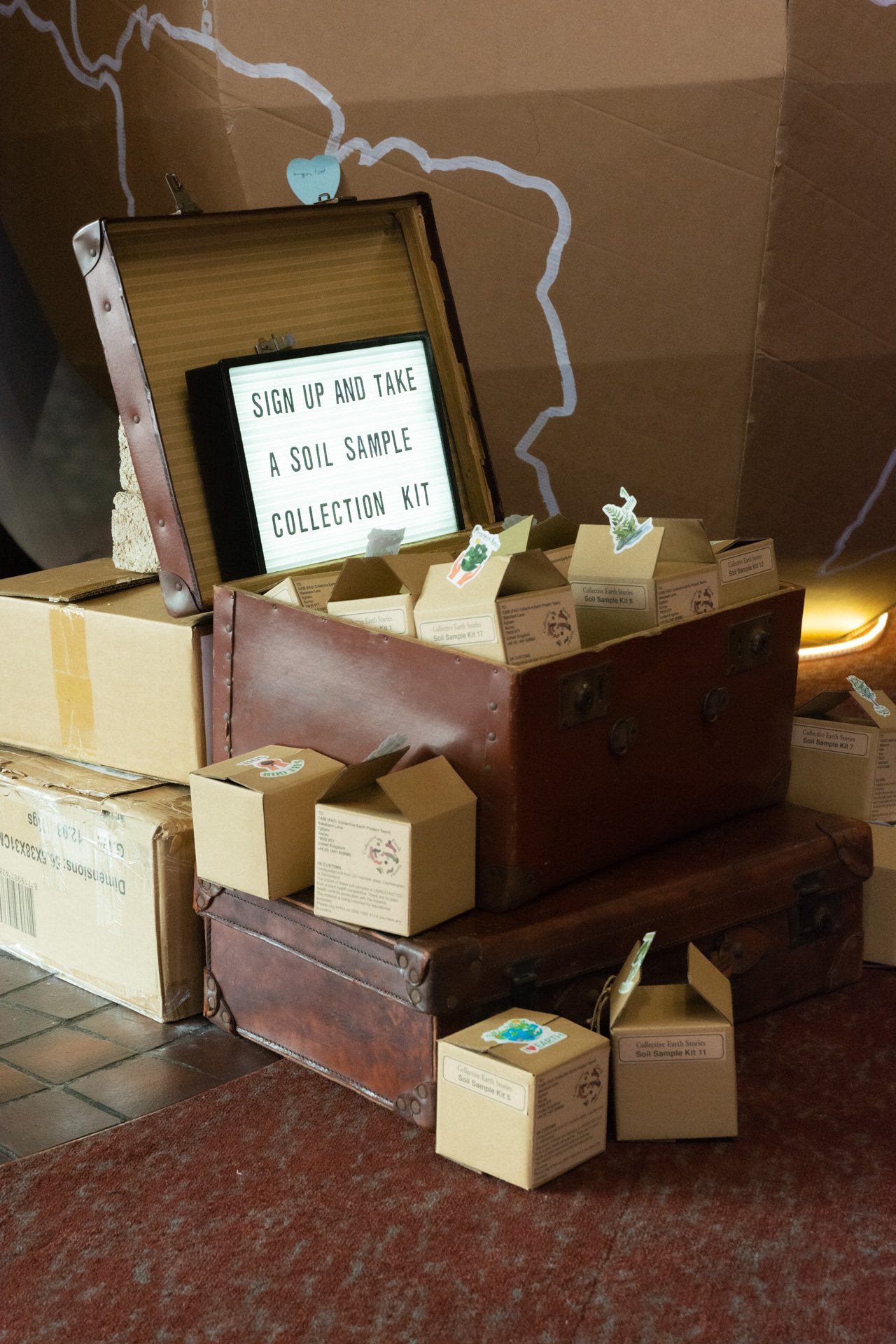 Soil sample collection kits in a vintage suitcase