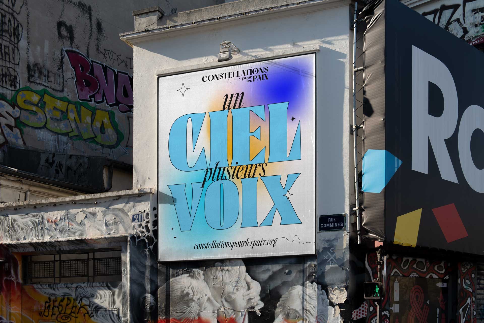 Un ciel, plusieurs voix billboard on a Paris street