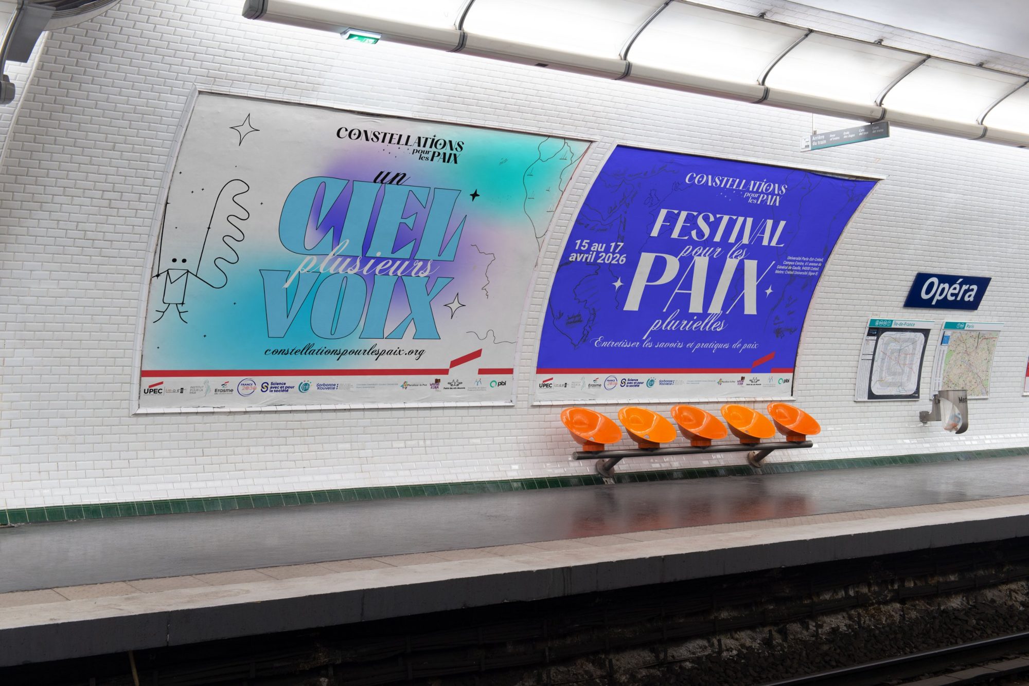 Two campaign posters on a Paris metro platform