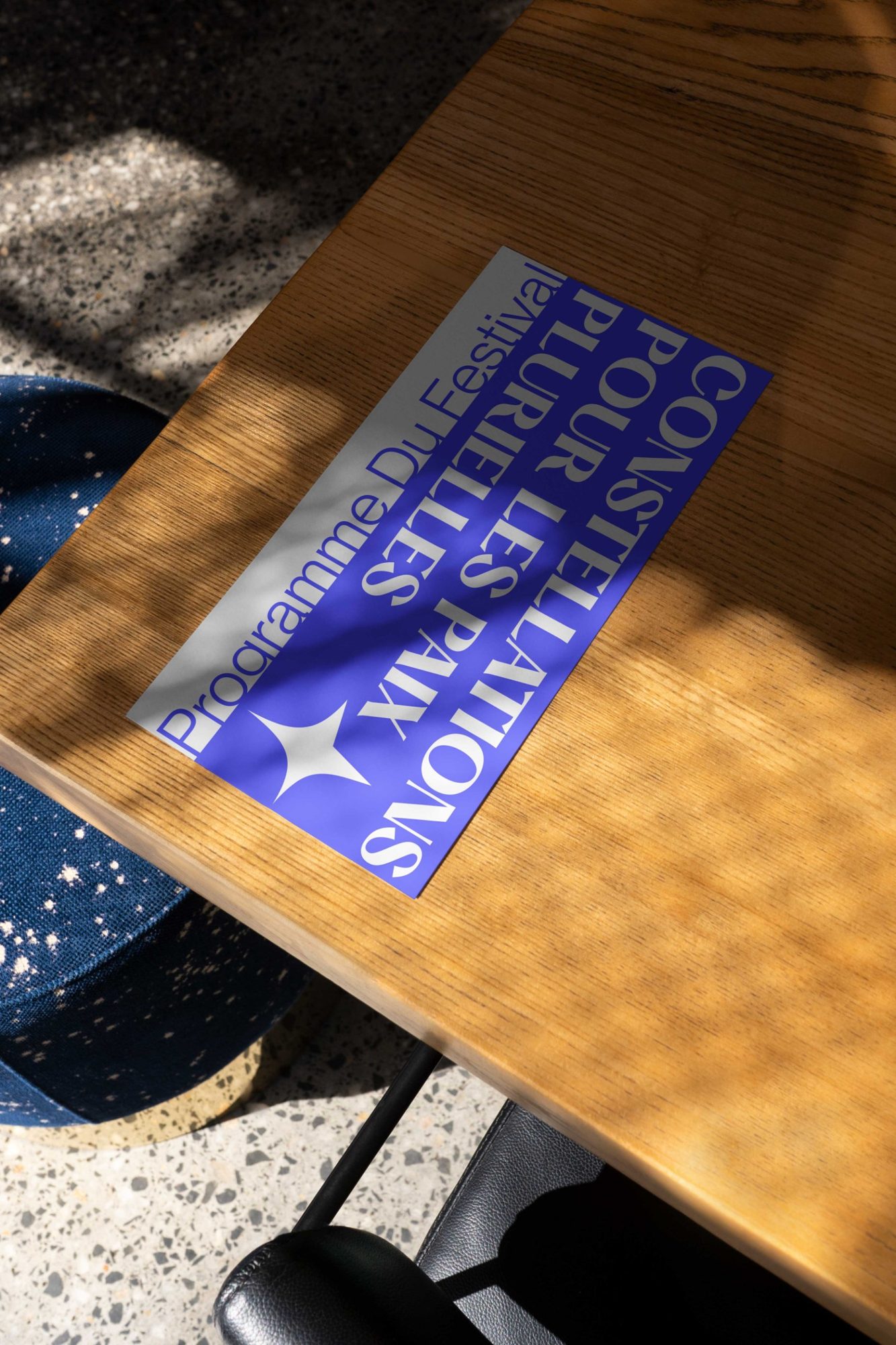 Festival programme cover on a café table
