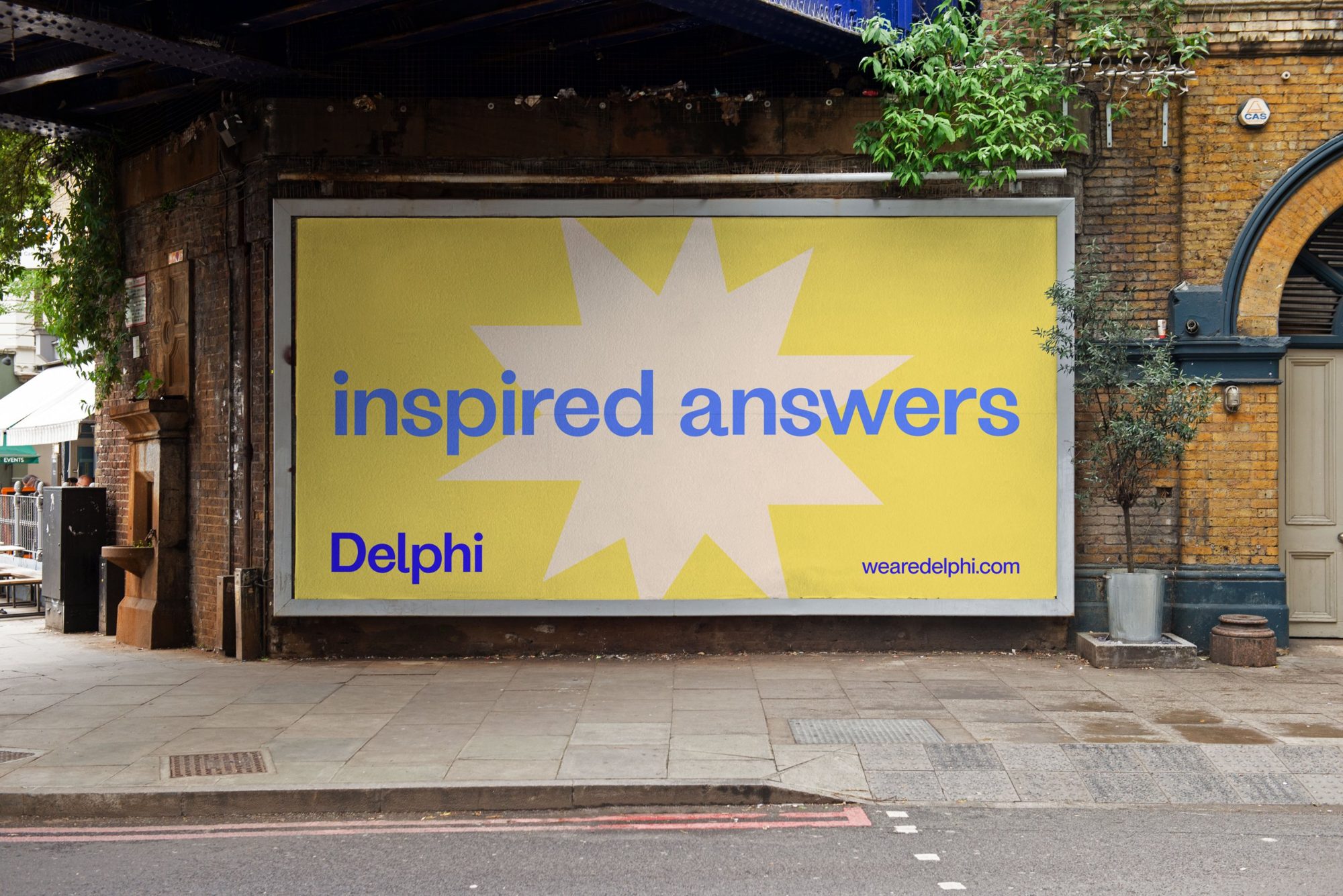 Inspired answers billboard under a railway bridge