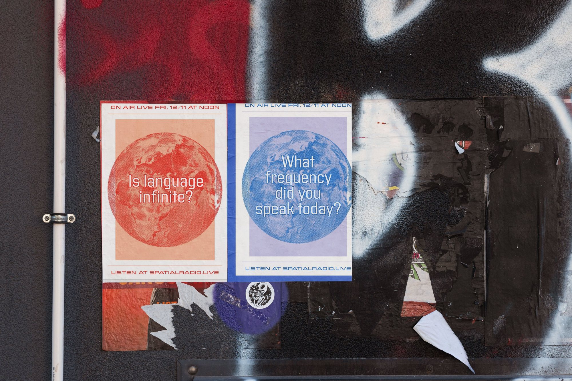 Two ZERO posters on a street wall